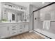 Bright bathroom with double vanity, modern fixtures, and a tiled shower at 1713 Real St, Indianapolis, IN 46240