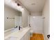 Neutral bathroom features a tub/shower combo and double sink vanity with stone countertop at 1713 Real St, Indianapolis, IN 46240