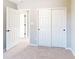 Neutral bedroom featuring carpet and a closet with sliding doors at 1713 Real St, Indianapolis, IN 46240