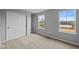 Bright bedroom with neutral carpet, closet, and two windows offering natural light at 1713 Real St, Indianapolis, IN 46240