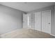 Neutral carpeting, light gray walls, and a closet can be found in this bedroom at 1713 Real St, Indianapolis, IN 46240