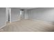 Spacious bedroom with neutral carpet and fresh, light gray paint throughout at 1713 Real St, Indianapolis, IN 46240