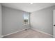 Bedroom featuring a window, neutral paint, carpet, and white trim at 1713 Real St, Indianapolis, IN 46240