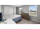 Bedroom featuring neutral-toned walls, carpet, and stylish furniture, with natural light from the windows at 1713 Real St, Indianapolis, IN 46240