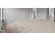 Large bedroom featuring neutral carpeting, light gray walls, and a modern en-suite bathroom at 1713 Real St, Indianapolis, IN 46240