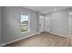 Bright entryway featuring hardwood floors, neutral paint, and a large window at 1713 Real St, Indianapolis, IN 46240