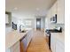 Spacious kitchen featuring an island, stainless steel appliances, and hardwood flooring at 1713 Real St, Indianapolis, IN 46240