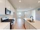 Modern kitchen featuring stainless steel appliances, white cabinets, and a stylish island at 1713 Real St, Indianapolis, IN 46240