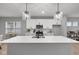Modern kitchen island with pendant lighting and stainless-steel appliances at 1713 Real St, Indianapolis, IN 46240