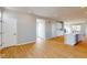 Open-concept living room and kitchen with hardwood floors and bright lighting at 1713 Real St, Indianapolis, IN 46240