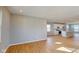 Bright and airy living room featuring beautiful hardwood floors that lead to the modern kitchen at 1713 Real St, Indianapolis, IN 46240