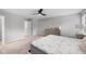 Main bedroom featuring a ceiling fan, neutral colors, and carpet at 1713 Real St, Indianapolis, IN 46240