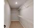 Walk-in closet features carpeted floor and metal shelving at 1713 Real St, Indianapolis, IN 46240