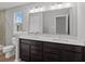 Primary bathroom with double sinks, modern lighting and fixtures, and a fully-tiled shower at 1717 Real St, Indianapolis, IN 46240
