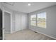 Bedroom features neutral walls, carpet, closet, and windows at 1717 Real St, Indianapolis, IN 46240