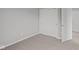 Bedroom with plush carpeting and closet with white sliding doors at 1717 Real St, Indianapolis, IN 46240
