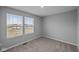 Bedroom has carpet, neutral walls, and a window at 1717 Real St, Indianapolis, IN 46240
