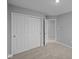 Bedroom features neutral walls, carpet, and closet at 1717 Real St, Indianapolis, IN 46240