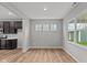 Dining room showcases a bright window with an open-concept view into the kitchen at 1717 Real St, Indianapolis, IN 46240