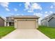 Detached garage with extra long driveway and green yard at 1717 Real St, Indianapolis, IN 46240