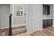 Hallway with stairs, neutral carpet, and a view into the kitchen at 1717 Real St, Indianapolis, IN 46240