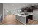 Open-concept kitchen featuring an island and stainless steel appliances at 1717 Real St, Indianapolis, IN 46240