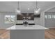 Modern kitchen with a large island, stainless steel appliances, and stylish pendant lighting at 1717 Real St, Indianapolis, IN 46240