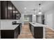 Modern kitchen with a large island, stainless steel appliances, and stylish pendant lighting at 1717 Real St, Indianapolis, IN 46240