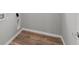 Interior laundry room boasts clean white trim and vinyl wood flooring at 1717 Real St, Indianapolis, IN 46240
