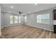Bright living room features three windows and hardwood flooring at 1717 Real St, Indianapolis, IN 46240
