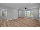 Spacious living room featuring ample natural light and wood flooring, ideal for entertaining at 1717 Real St, Indianapolis, IN 46240