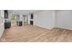 Spacious open-concept living area and kitchen with hardwood floors and abundant light at 1717 Real St, Indianapolis, IN 46240