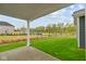 Covered patio overlooking the lawn and pond at 1721 Real St, Indianapolis, IN 46240