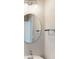 A view of the bathroom with a large round mirror with a chrome faucet and towel bar at 1721 Real St, Indianapolis, IN 46240