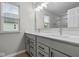 Bathroom features a double sink vanity with quartz countertops and modern fixtures at 1721 Real St, Indianapolis, IN 46240