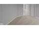 Carpeted room featuring neutral walls and a door leading to additional rooms at 1721 Real St, Indianapolis, IN 46240