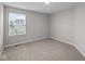 Bedroom featuring a window with blinds and neutral carpet at 1721 Real St, Indianapolis, IN 46240