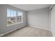 Bedroom with carpet flooring and natural light from a large window at 1721 Real St, Indianapolis, IN 46240