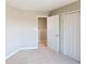 Carpeted bedroom featuring a closet with sliding doors and a view of the hallway at 1721 Real St, Indianapolis, IN 46240
