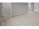 A carpeted bedroom offers a view into the attached bathroom at 1721 Real St, Indianapolis, IN 46240