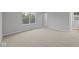 A carpeted bedroom features large windows providing natural light at 1721 Real St, Indianapolis, IN 46240