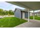 Attached garage exterior featuring a well-manicured lawn and siding at 1721 Real St, Indianapolis, IN 46240