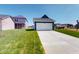 A charming two-car garage with a well-maintained green lawn at 1721 Real St, Indianapolis, IN 46240