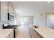Well-lit kitchen equipped with an island, stainless steel appliances, and modern finishes at 1721 Real St, Indianapolis, IN 46240