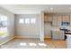 Bright kitchen area with stainless steel appliances, neutral cabinets, and a spacious layout at 1721 Real St, Indianapolis, IN 46240