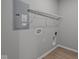 A modern laundry room featuring a wire shelf and hookups at 1721 Real St, Indianapolis, IN 46240