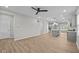 Spacious open-concept living area featuring modern finishes, wood flooring, and seamless flow to kitchen at 1721 Real St, Indianapolis, IN 46240