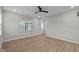 Neutral living room offers wood flooring, contemporary fixtures, and natural light from the window at 1721 Real St, Indianapolis, IN 46240