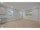 Living room features lots of windows and wood-look flooring at 1721 Real St, Indianapolis, IN 46240
