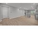 Open concept living space with wood-look floors and light gray walls at 1721 Real St, Indianapolis, IN 46240